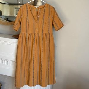 T-shirt dress. It has a worn linen look but is 10%linen.